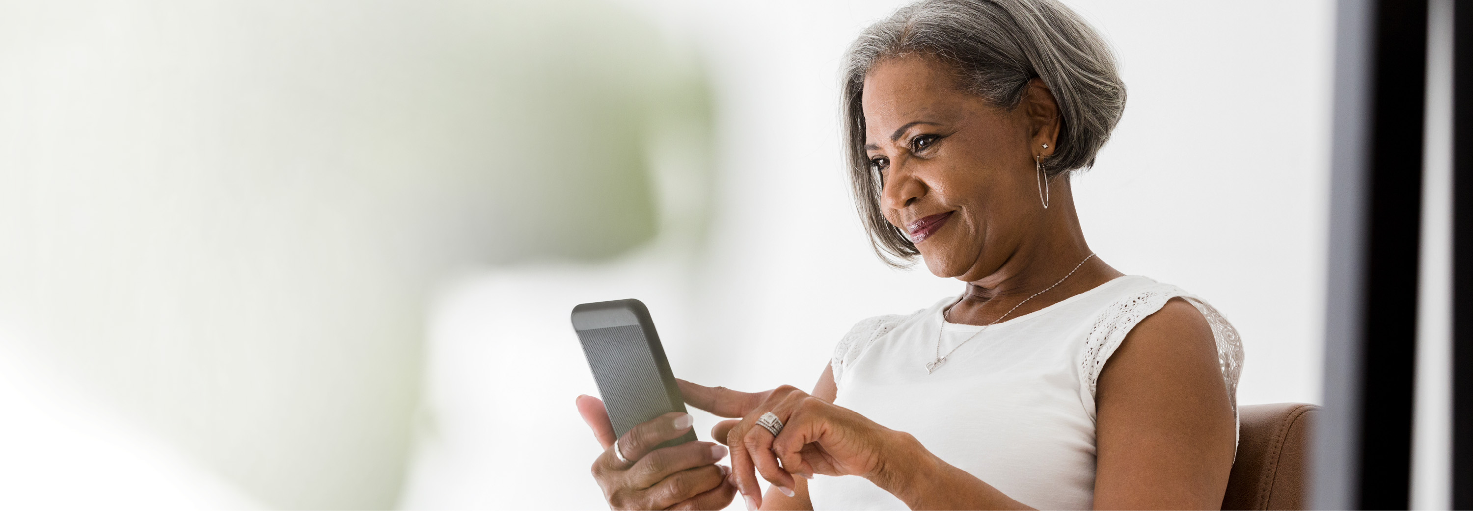 elderly woman with smartphone