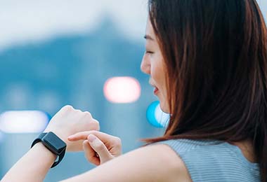 Woman Adjusting Watch