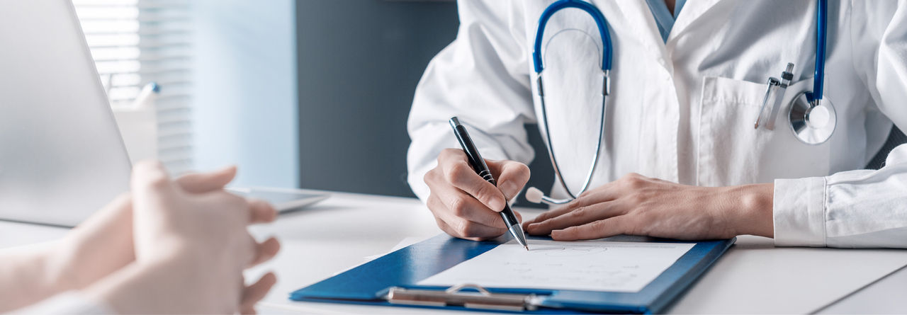 doctor and patient signing documents